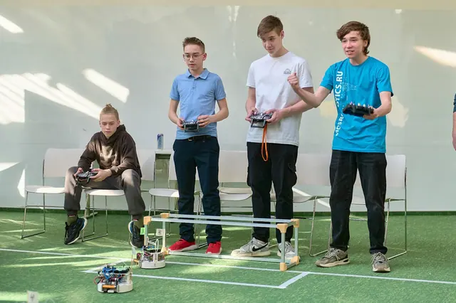 Operators drive their robots in the final match. March 15, 2025